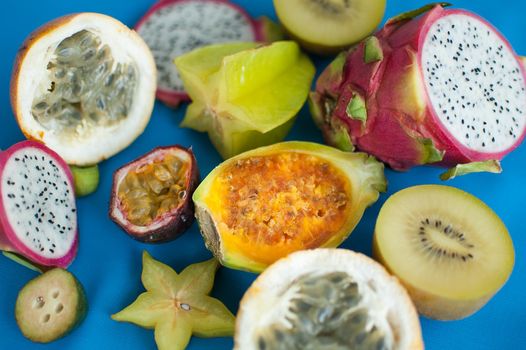 Group of fresh tropical fruits, passion fruit, carambola, dragon fruit or pitaya, mangosteen, lichi, granadilla. Exotic fruits, healthy eating concept.