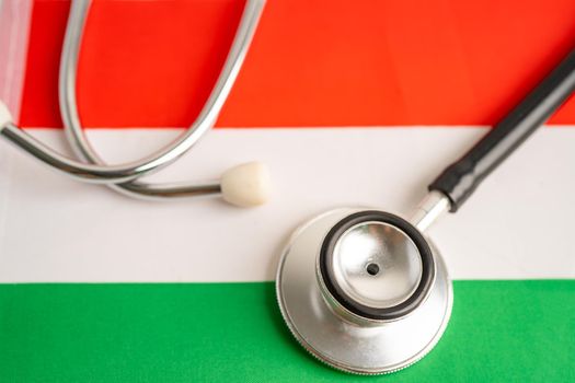 Black stethoscope on Hungary flag background, Business and finance concept.