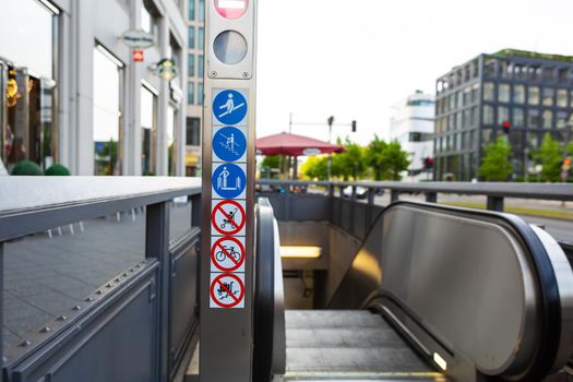 Escalator from the underpass to the city street. Caring for pedestrians.