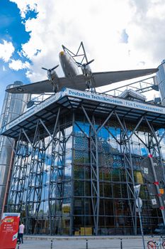 The plane is suspended from the facade of the building of the Aircraft Museum in Berlin. Berlin, Germany - 05.17.2019