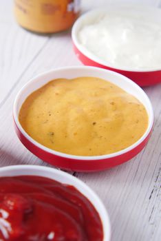 close up of Mayonnaise, sauce n container on table .