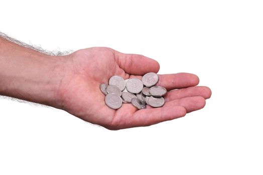 a handful of metal coins in the man's hand. isolated on a white background. Ukrainian hryvnia. concept of poverty