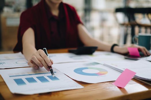 Close-up of a business woman audit the company's budget. Tax information is calculated by accountants