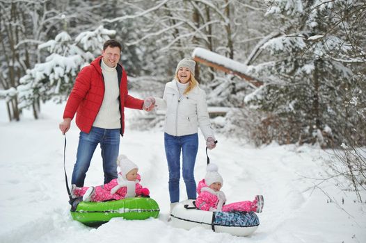 A large family with children on a walk in winter.