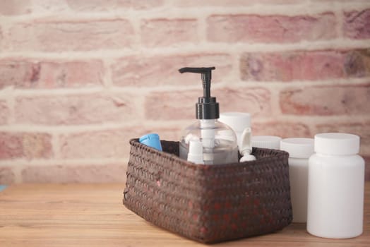 close up of many hand sanitizer in a box on table .