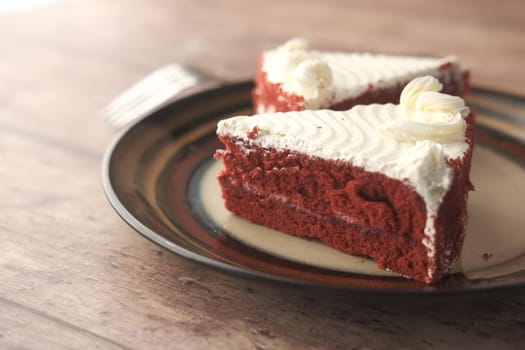 chocolate and cream cake on a plate on table .