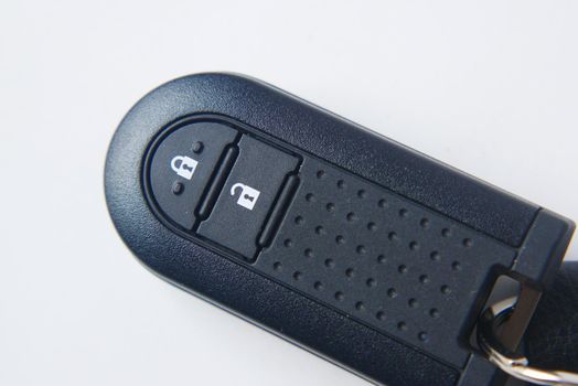 close up of car key on white background