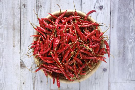 dried peppers in a bowl on table ,
