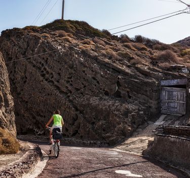 Tour by bike through the streets of Linosa in the summer season, Sicily