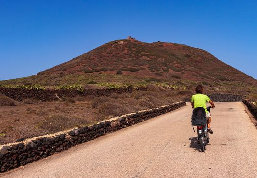 Tour by bike through the streets of Linosa in the summer season, Sicily