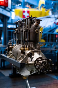 Close-up of a detail of a rare car engine. Metal mechanisms. Automotive industry.