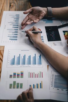 Fund managers team consultation and discuss about analysis Investment stock market by financial document chart