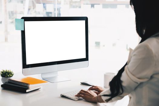 Mockup computer desktop with blank screen. Group of business people meeting and brainstorming by video conference