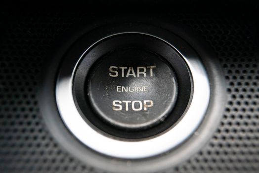 Macro detail of Start engine button in a modern car