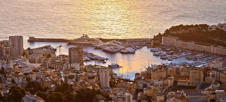 Monte Carlo luxury yacht harbor Port Hercules aerial sunrise view, Principality of Monaco