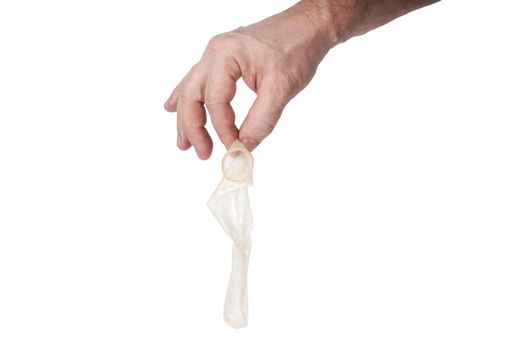 Hand holds a condom on a white background, template for designers.