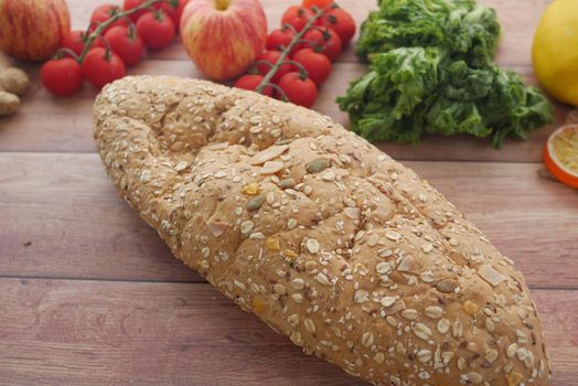 whole meal bread, apple and cherry tomato on table ,