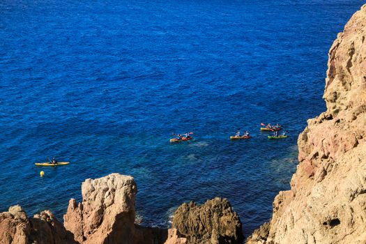 Cabo de Gata, Almeria, Spain- September 3, 2021:People practicing canoeing in the Reef of the Sirens in Cabo de Gata, Almeria, Spain.