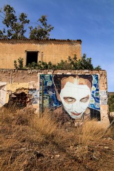 Rodalquilar, Almeria, Spain- September 3, 2021:Picture on the wall of abandoned building of the gold mines of Rodalquilar village in Almeria province, Andalusia community, Spain.