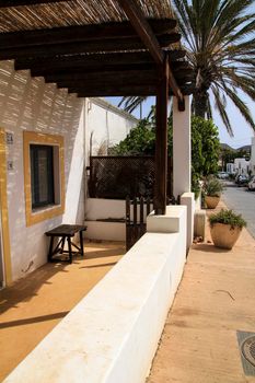 Rodalquilar, Almeria, Spain- September 7, 2021: Whitewashed houses with bougainvillea and cactus in Rodalquilar, Andalusia, Spain