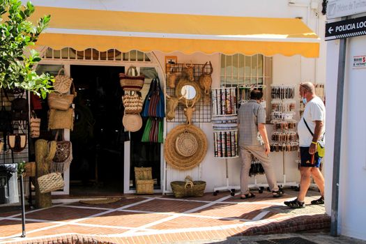 Mojacar, Almeria, Spain- September 8, 2021: Souvenirs and crafts shop in Mojacar village on a sunny day of summer.