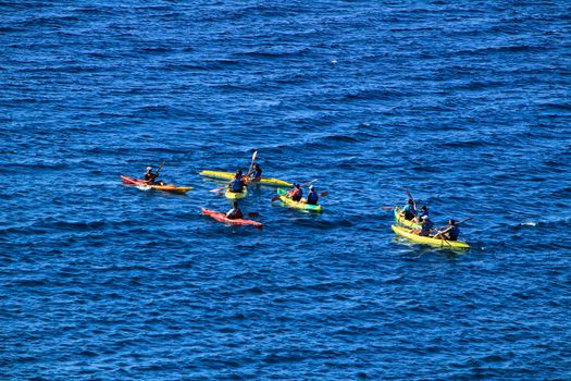 Cabo de Gata, Almeria, Spain- September 3, 2021:People practicing canoeing in the Reef of the Sirens in Cabo de Gata, Almeria, Spain.