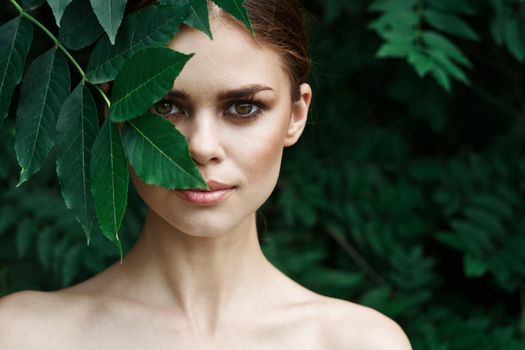 smiling woman Cosmetology nature green leaves glamor Lifestyle. High quality photo