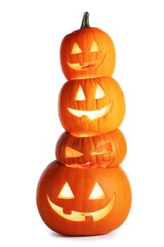 Stack of glowing Halloween Pumpkins isolated on white background