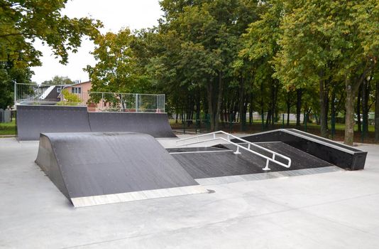 skatepark ramps in the park on autumn. High quality photo