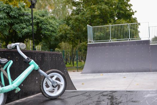 skatepark ramps in the park on autumn. High quality photo