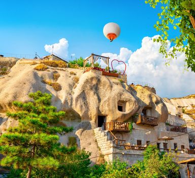 Hot air balloons at day in Goreme village, Cappadocia, Turkey