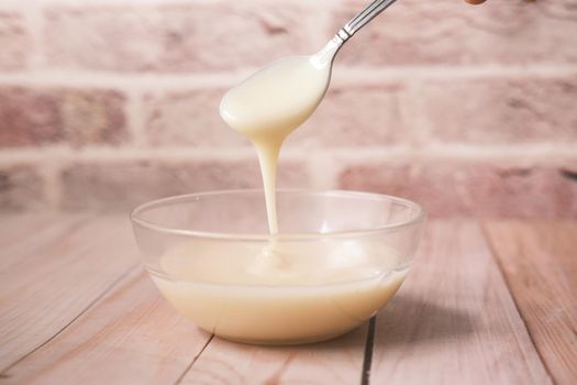 condensed milk in a bowl close up