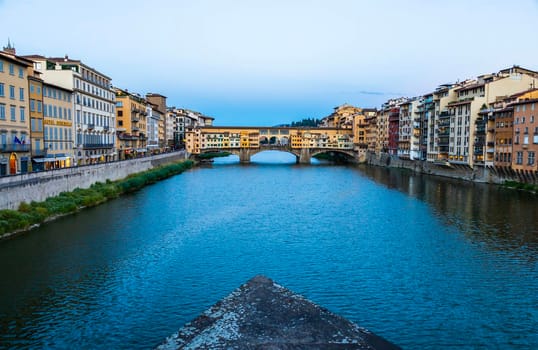 Florence, Italy - Circa June 2021: sunset on Ponte Vecchio - Old Bridge. Amazing blue light before the evening.