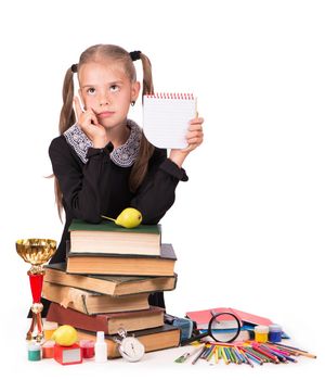 schoolgirl with books and school supplies isolated on white background.