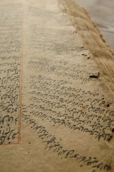 Tashkent, Uzbekistan - August 10, 2009: Ancient open book in arabic. Old arabic manuscripts and texts