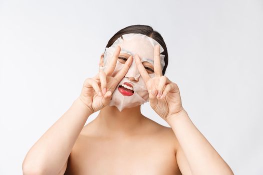 Spa, healthcare. Woman with purifying mask on her face isolated on white background