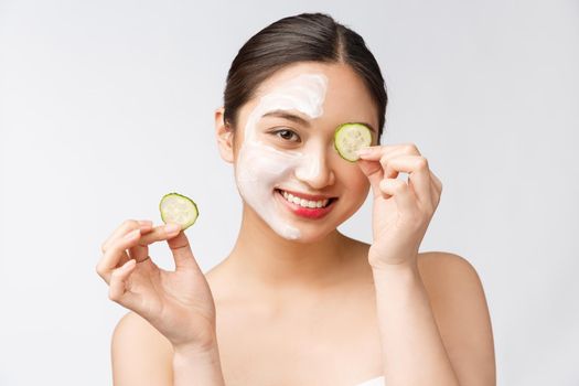 Beauty young asian women skin care image with cucumber on white background studio.