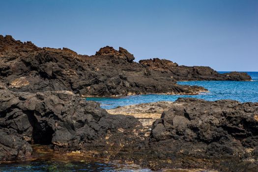 View of the lava beach of Linosa Called Mannarazza, Sicily. Italy