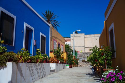 View of a typical colorful houses in the street of Linosa, Sicily. Italy