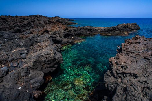 View of the lava beach of Linosa Called Mannarazza, Sicily. Italy