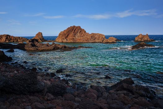 View of the lava beach of Linosa Called Faraglioni, Sicily. Italy