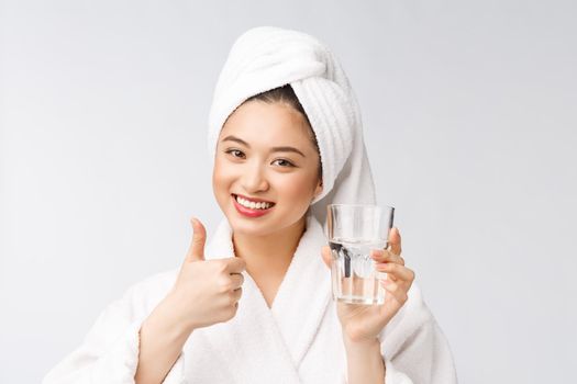 Healthy young beautiful woman drinking water, beauty face natural makeup, isolated over white background