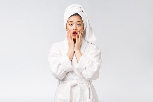 Spa skincare beauty Asian woman drying hair with towel on head after shower treatment. Beautiful multiracial young girl touching soft skin.