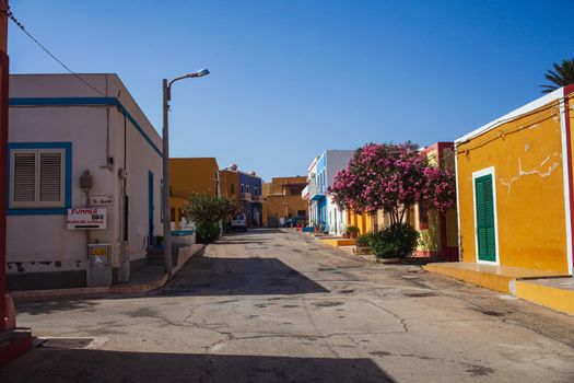 View of a typical street of Linosa with colorful house, Sicily. Italy