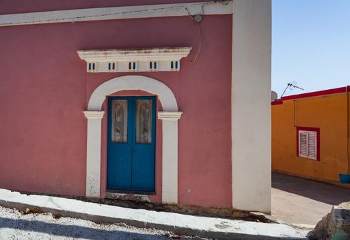 View of a typical colorful house of Linosa, colored with pink and white, Sicily. Italy