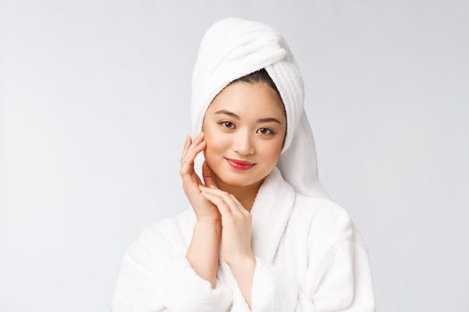 Portrait of a young happy asian lady in bathrobe.Isolated in white background
