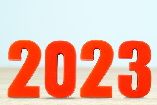 Shot of a number 2023 made of red plastic new year on table with copy space