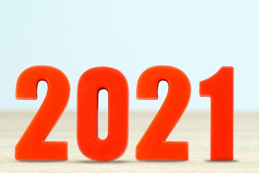 Shot of a number 2021 made of red plastic new year on table with copy space