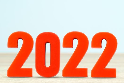 Shot of a number 2022 made of red plastic new year on table with copy space
