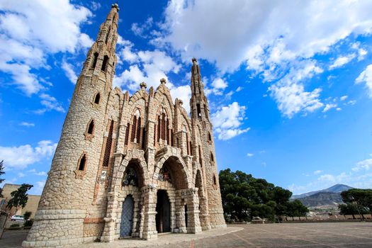 Novelda, Alicante, Spain- September 24, 2021: Details, archs, tower and pictures of Sanctuary of Santa Maria Magdalena on the top of the mountain in Novelda, Alicante, Spain.